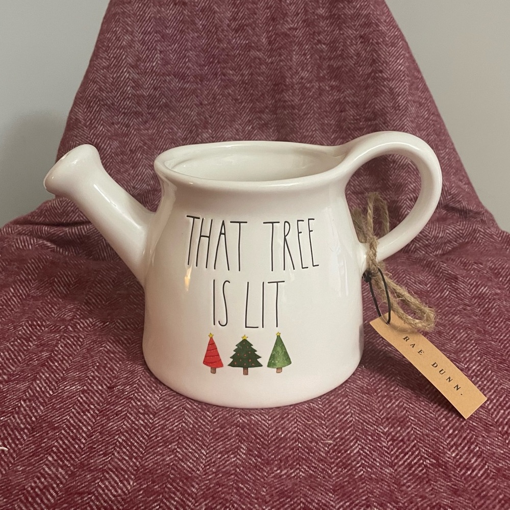 Rae Dunn “That Tree is Lit” ceramic watering can planter.